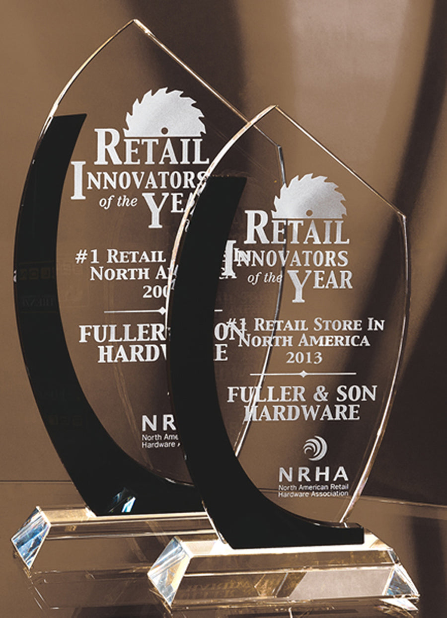 Clear crystal glass trophies with black accents and sand etch engraving.