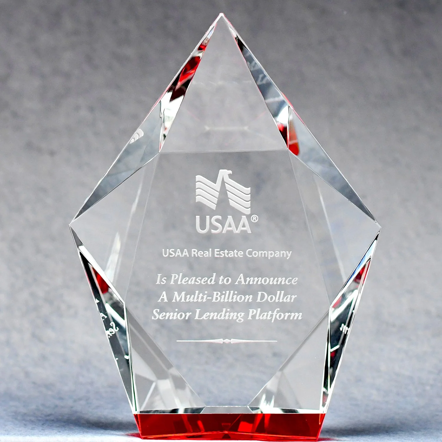 Faceted Pentagon Crystal award with USAA logo and text on a gray background