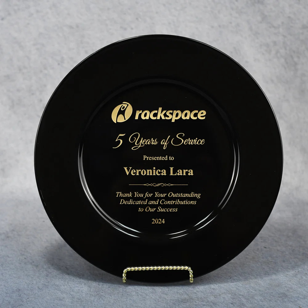A black glass plate with gold text, personalized with the name Veronica Lara, presented by Rackspace for 5 years of service.