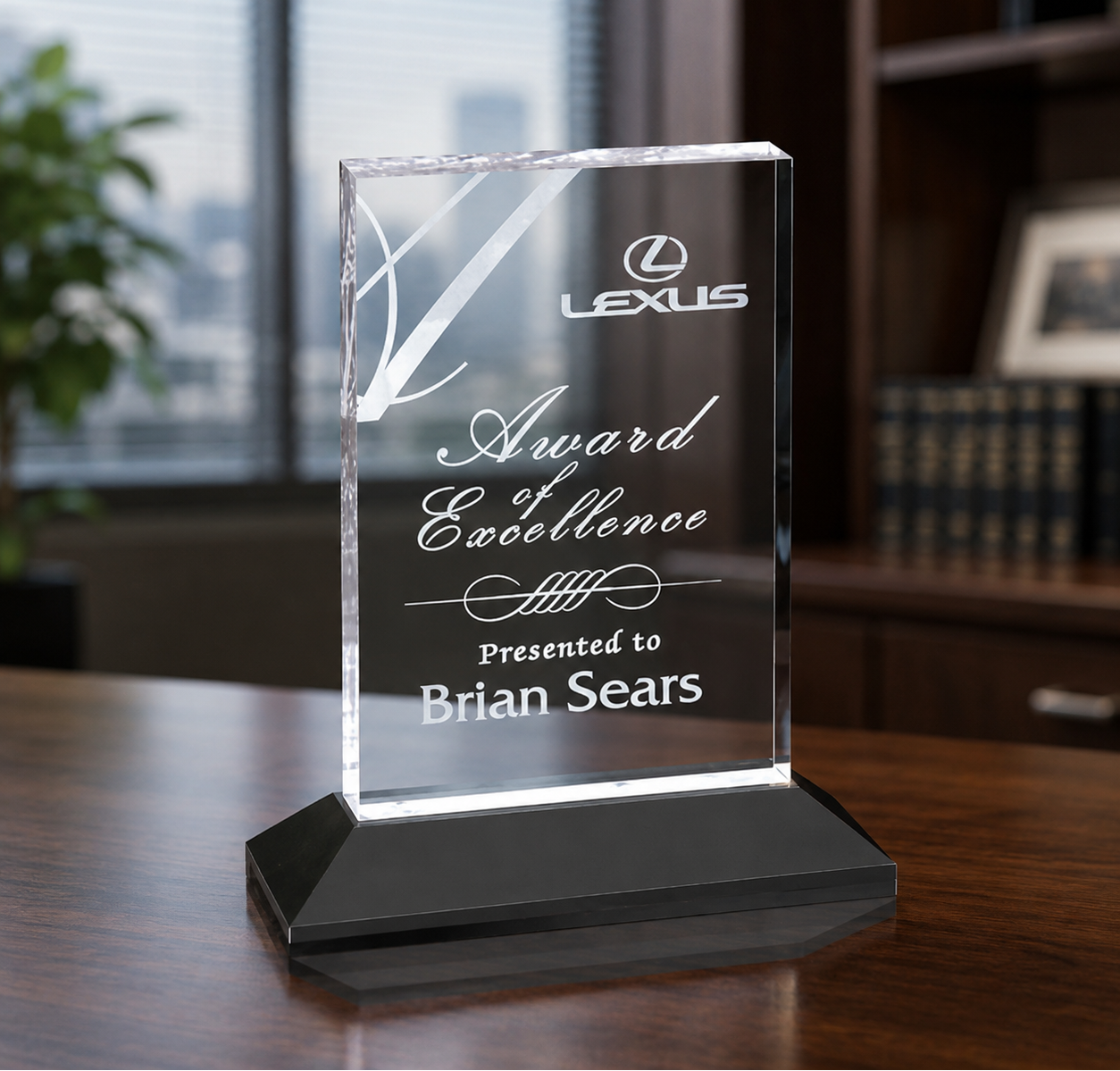 Clear acrylic deal tombstone on black base with custom engraved logo and recognition text.