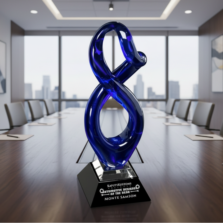 Blue glass number 8 sculpture on a pedestal in a conference room with large windows.