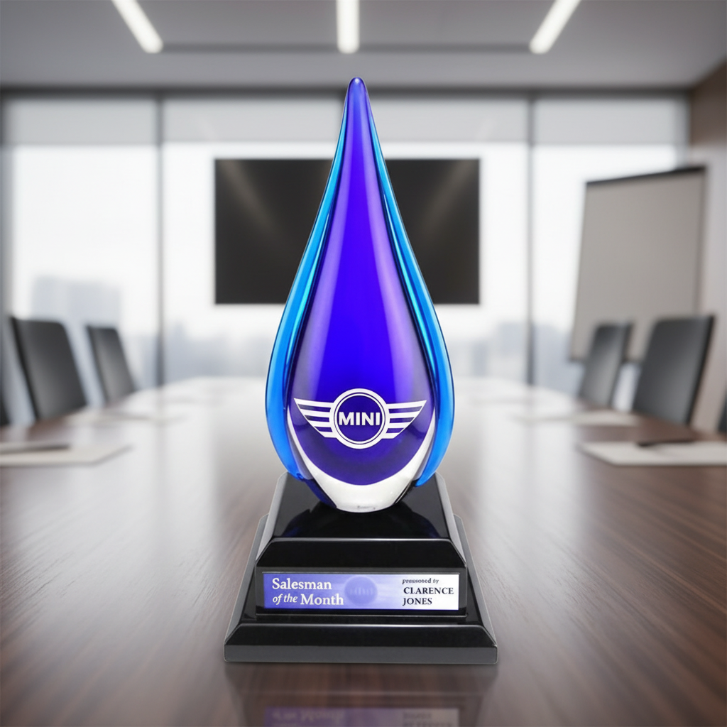 Blue teardrop glass award with sand etch logo and silver full color personalization plate