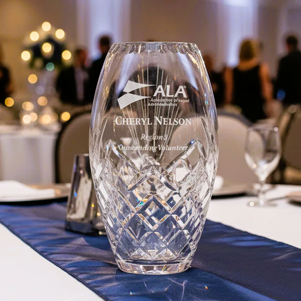 Crystal vase with engraved text on a awards banquet