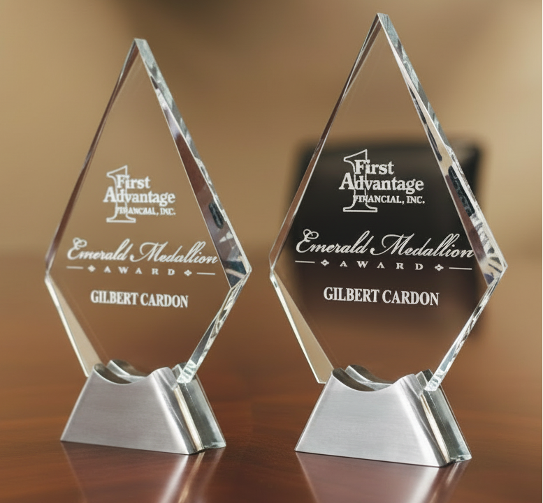 Two crystal spirit awards with logo branding on an aluminum base.