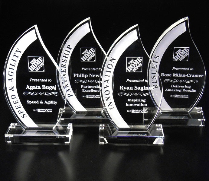 Four Crystal Flame glass awards on a black background