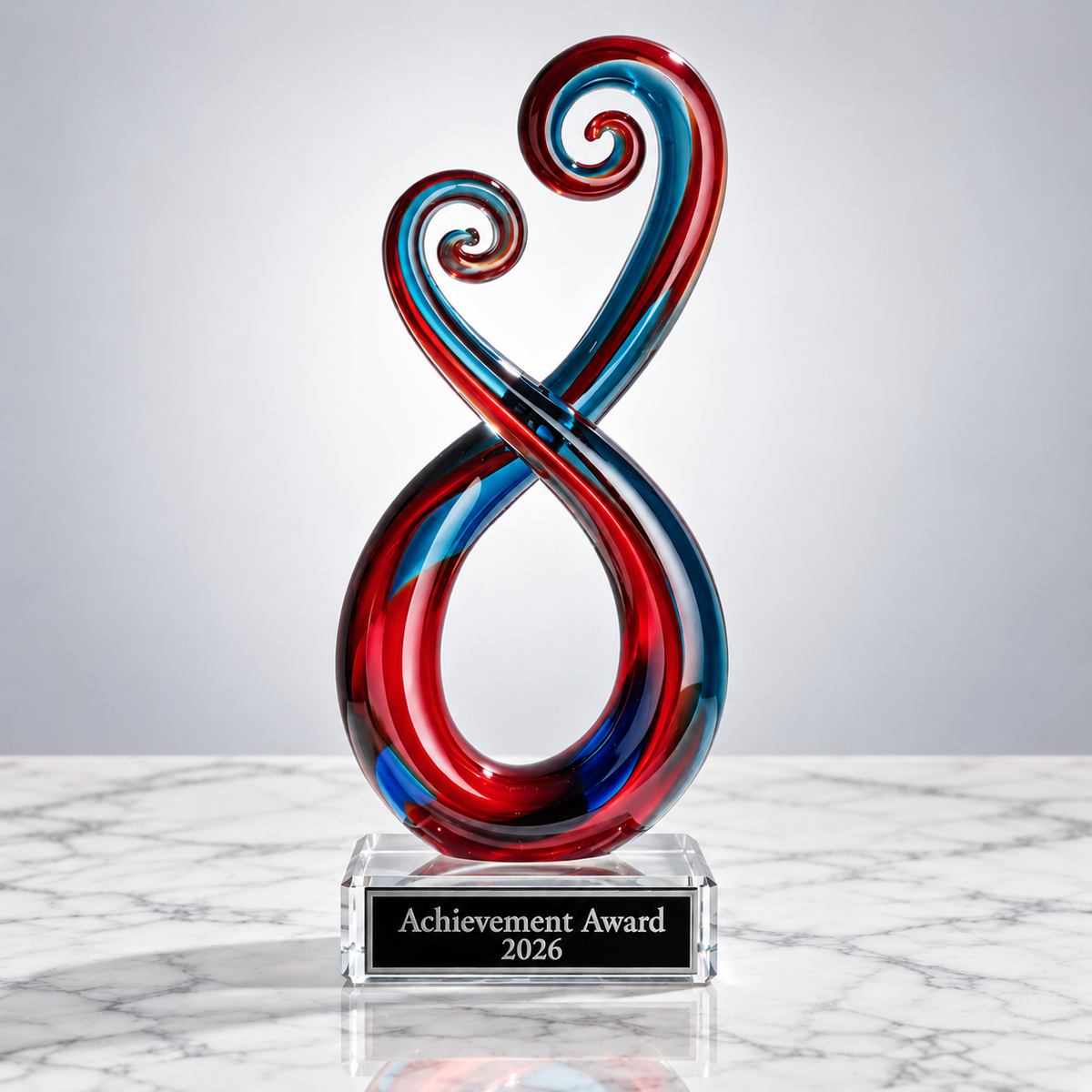 Colorful glass sculpture of an infinity symbol with engraved plate