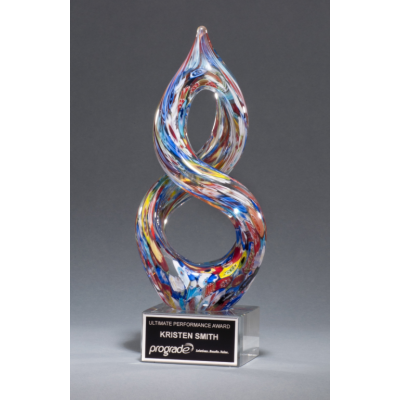 A helix-shaped multi-color art glass award with a laser engraved aluminum plate on a glass base.