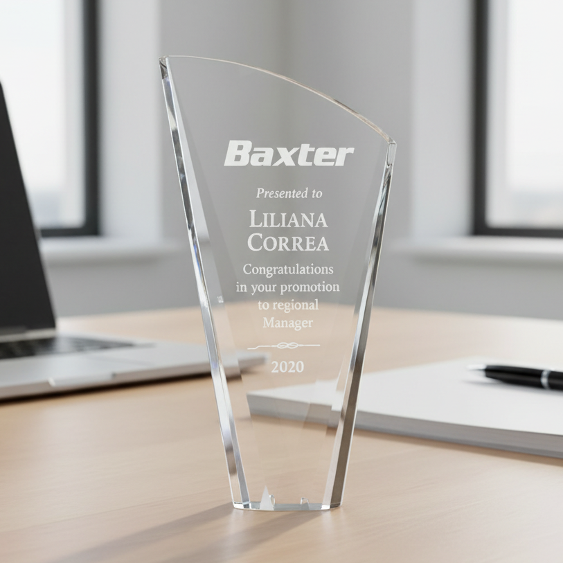 Clear crystal glass award with engraved text and logo