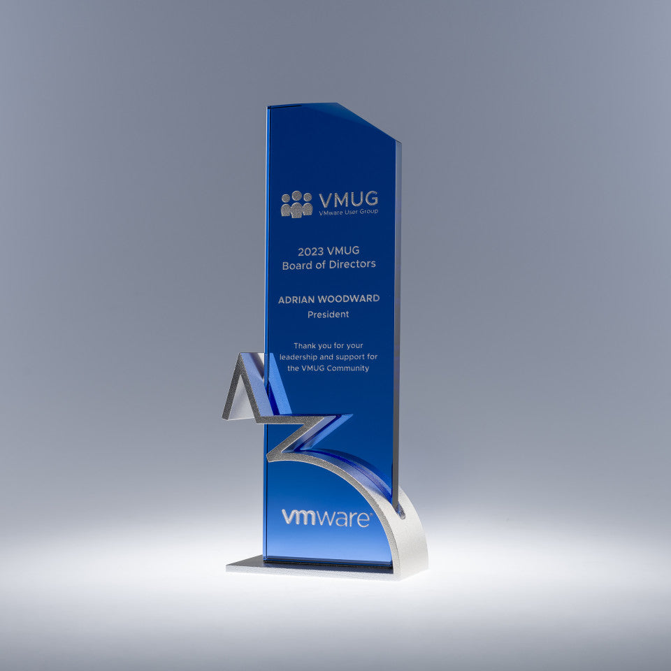 Crystal glass award with sand etch engraved text and logo on metal base with accent