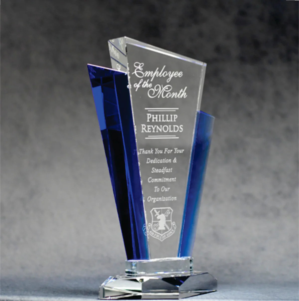 Pristine optic clear crystal, this award features striking blue accents on either side, adding a touch of elegance and contrast.