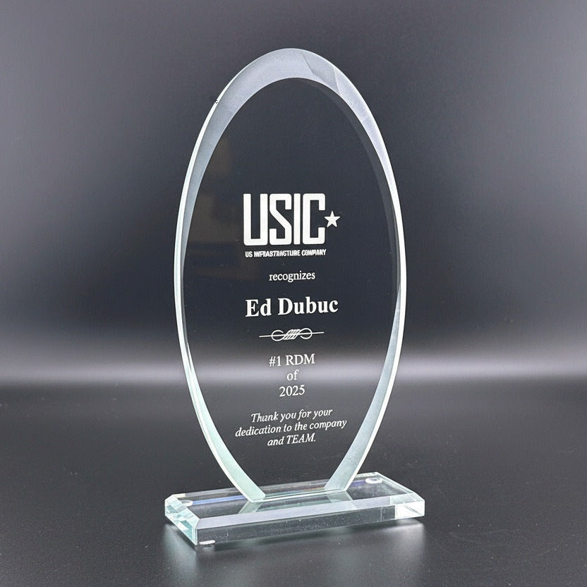 Glass award with frosted edges, sand etch engraved text on a glass base