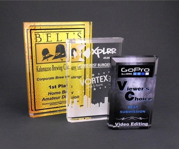 Three acrylic awards from different companies