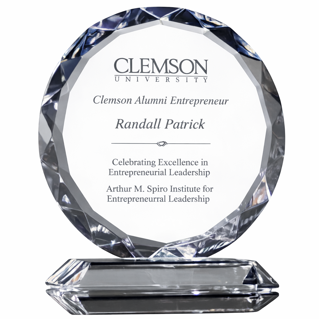 Faceted Round Crystal award with engraved text on a white background