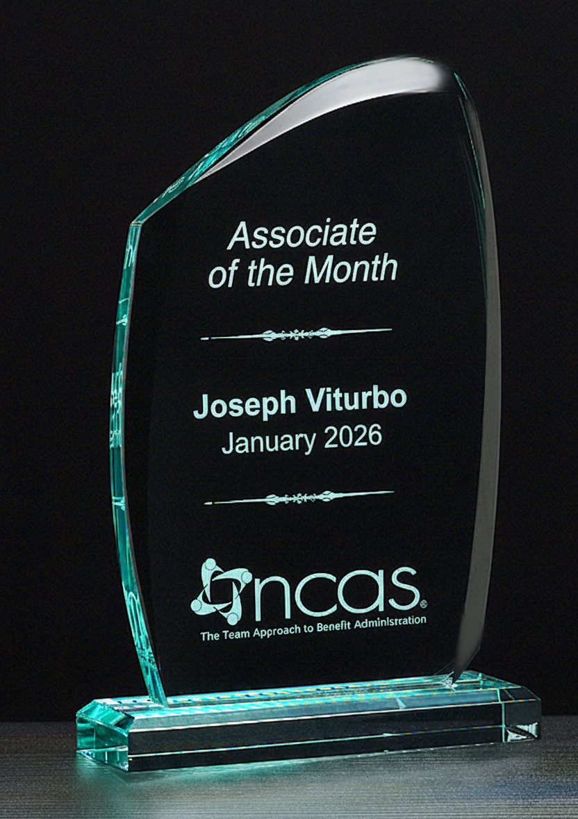 An acrylic award with engraved text 'Associate of the Month on an acrylic base.