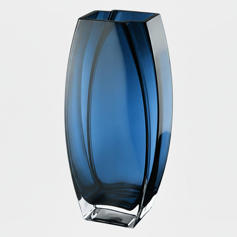 Blue glass vase on a light gray background