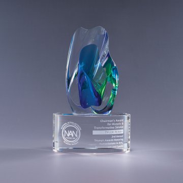 Decorative art glass award with a blue and green design on a gray background with sand etched lettering. Atlanta, Suwanee, Johns creek