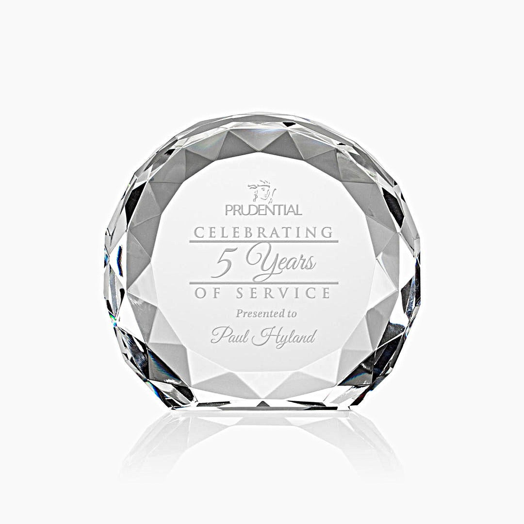 Clear crystal awards with faceted surfaces, sand etch engraved with recognition language such as 'Celebrating 20 Years of Service'.