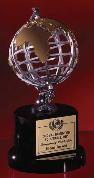 A silver and gold globe award with a black base, featuring a metal globe on top of a black crystal base with a red backdrop. The globe is designed to resemble the Earth, and there is a plaque with the text 'Globe Solutions, Inc.
