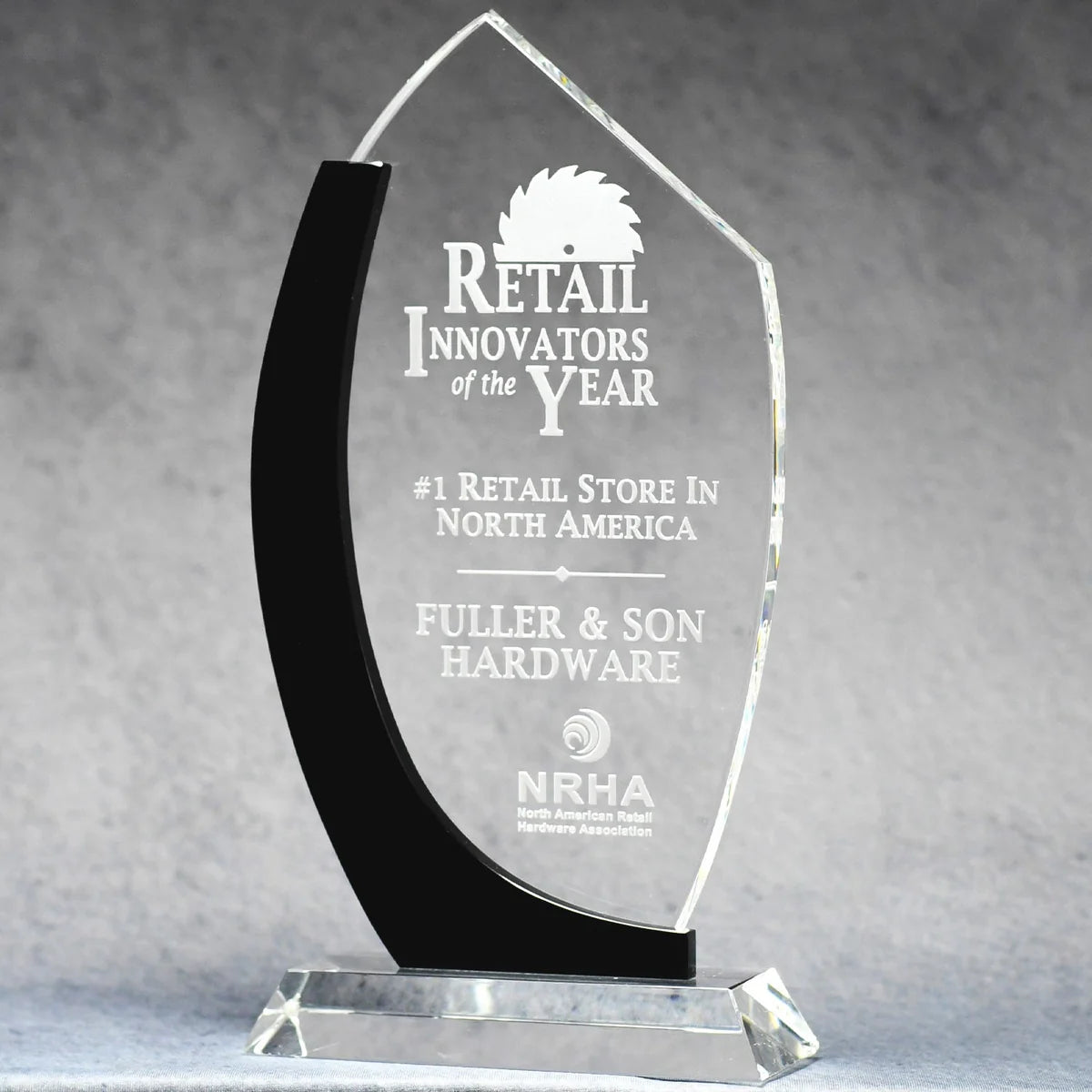 Clear optic crystal award with black edge accents and clear crystal base. Sand etch and color filled engraving.