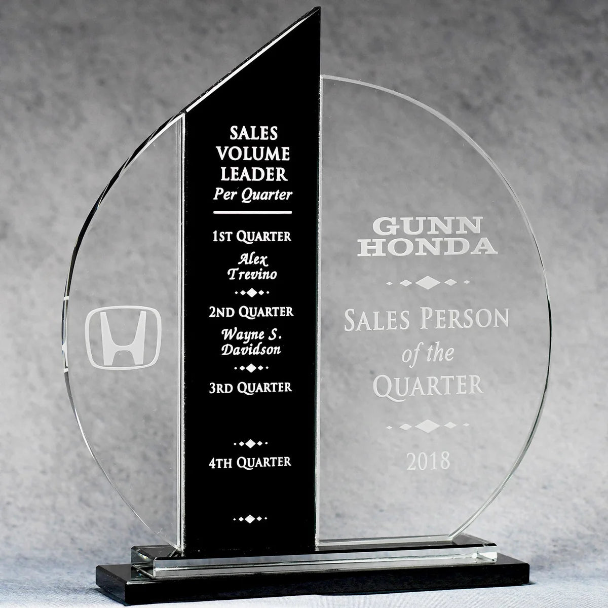 Crustal Glass award with engraved text and Honda logo on a gray background