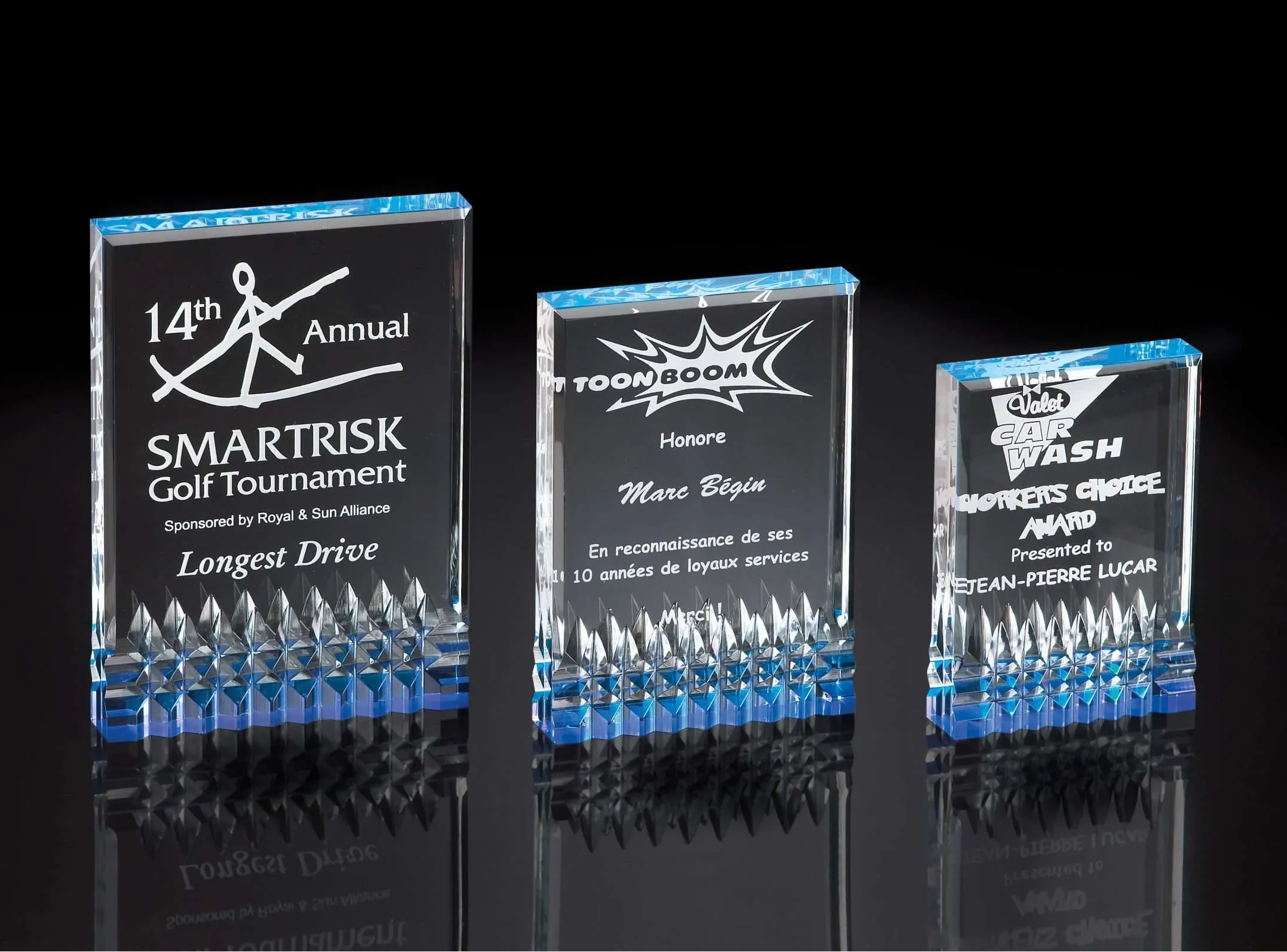 Acrylic awards in three sizes with engraved text and logo