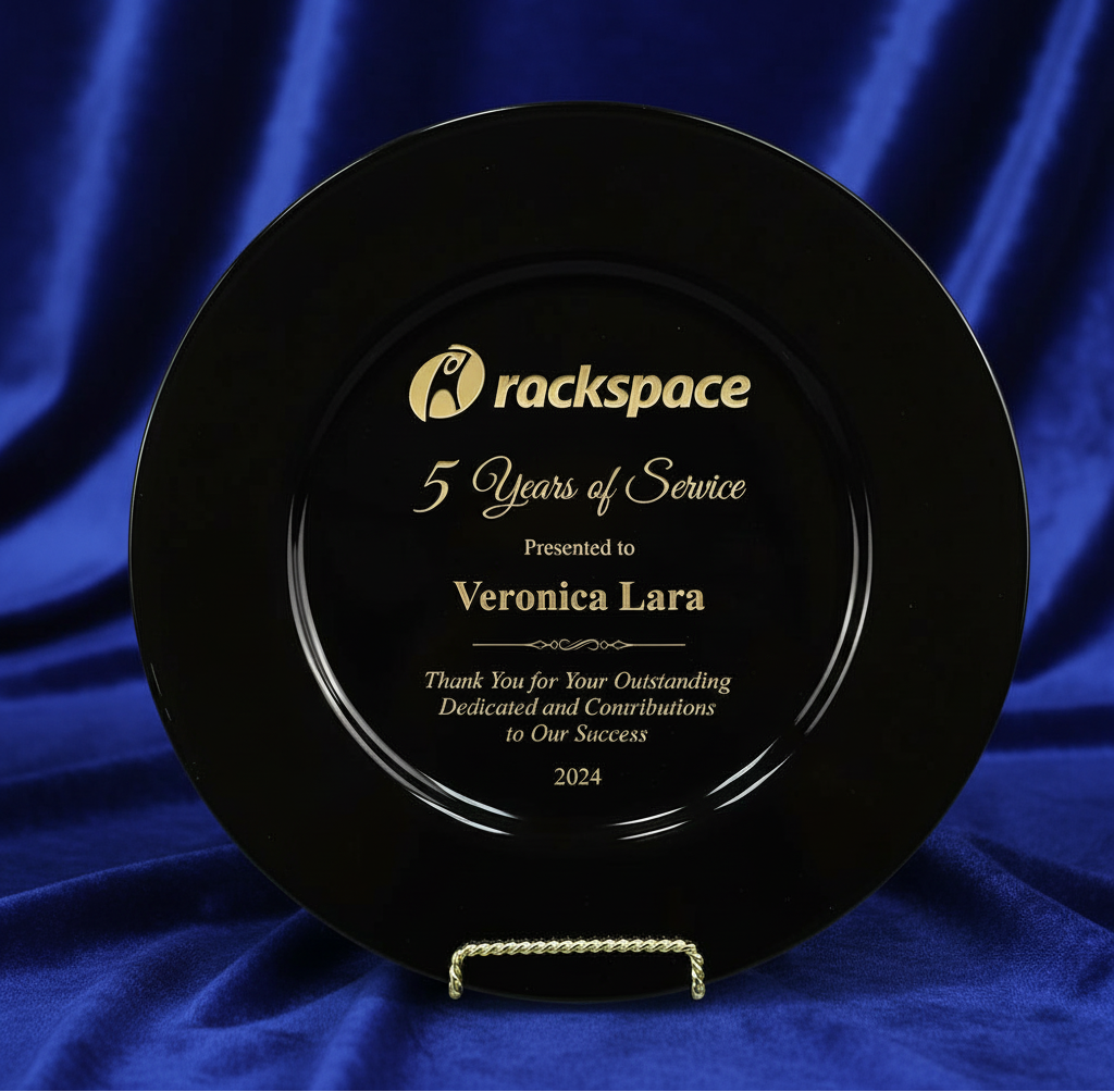 Black plaque with 'rackspace' logo and text on a blue fabric background