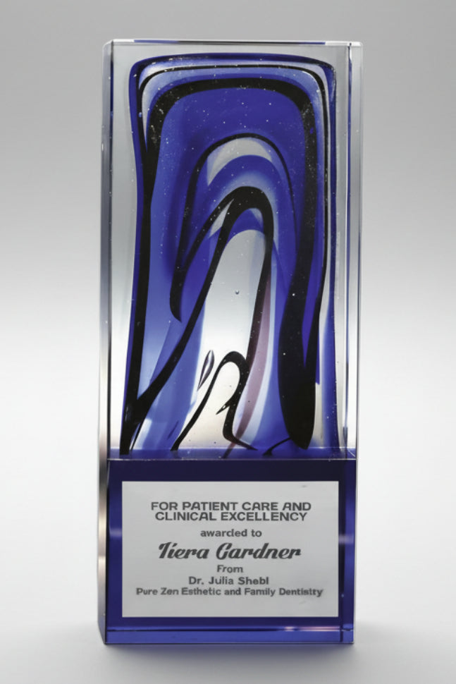 Decorative award with blue and black design on a gray background