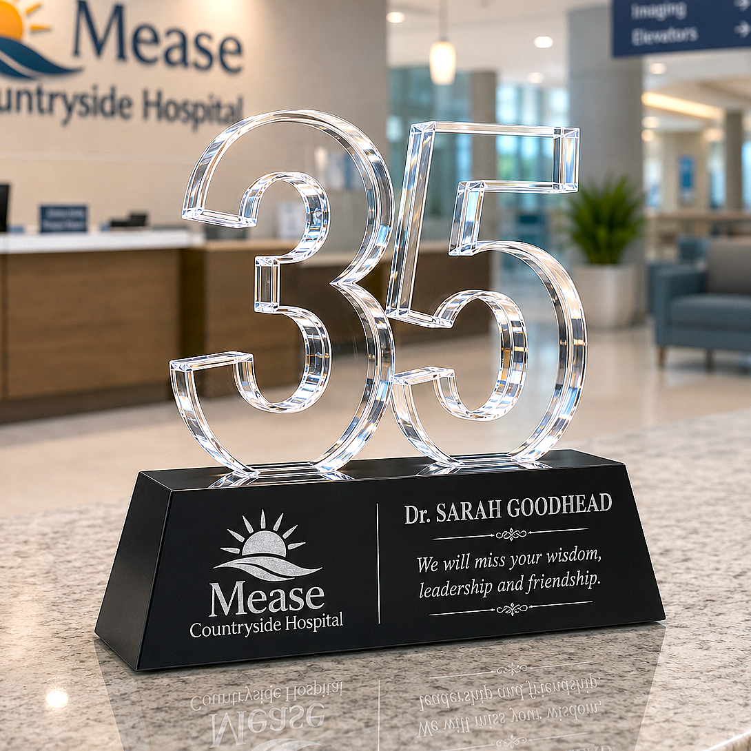 Crystal number '35' award on a black base with Mease Countryside Hospital branding in an indoor setting.