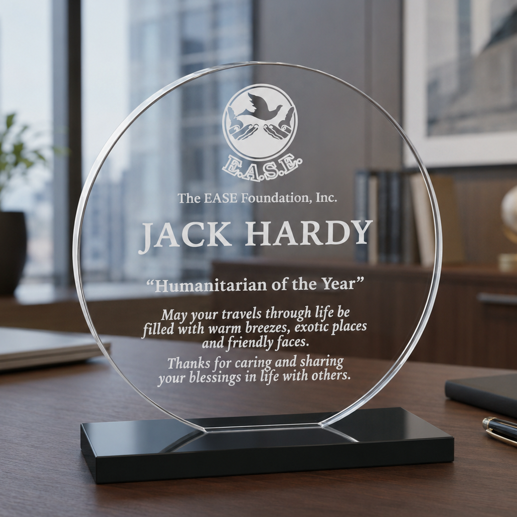 Circle Acrylic award trophy with engraved text on a desk in an office.