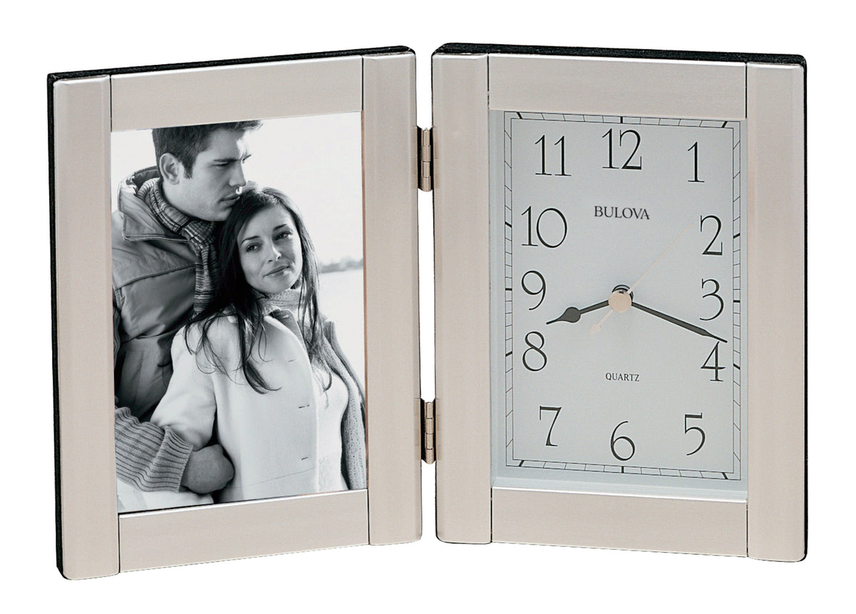 Bulova clock and photo frame with a couple's picture on a white background