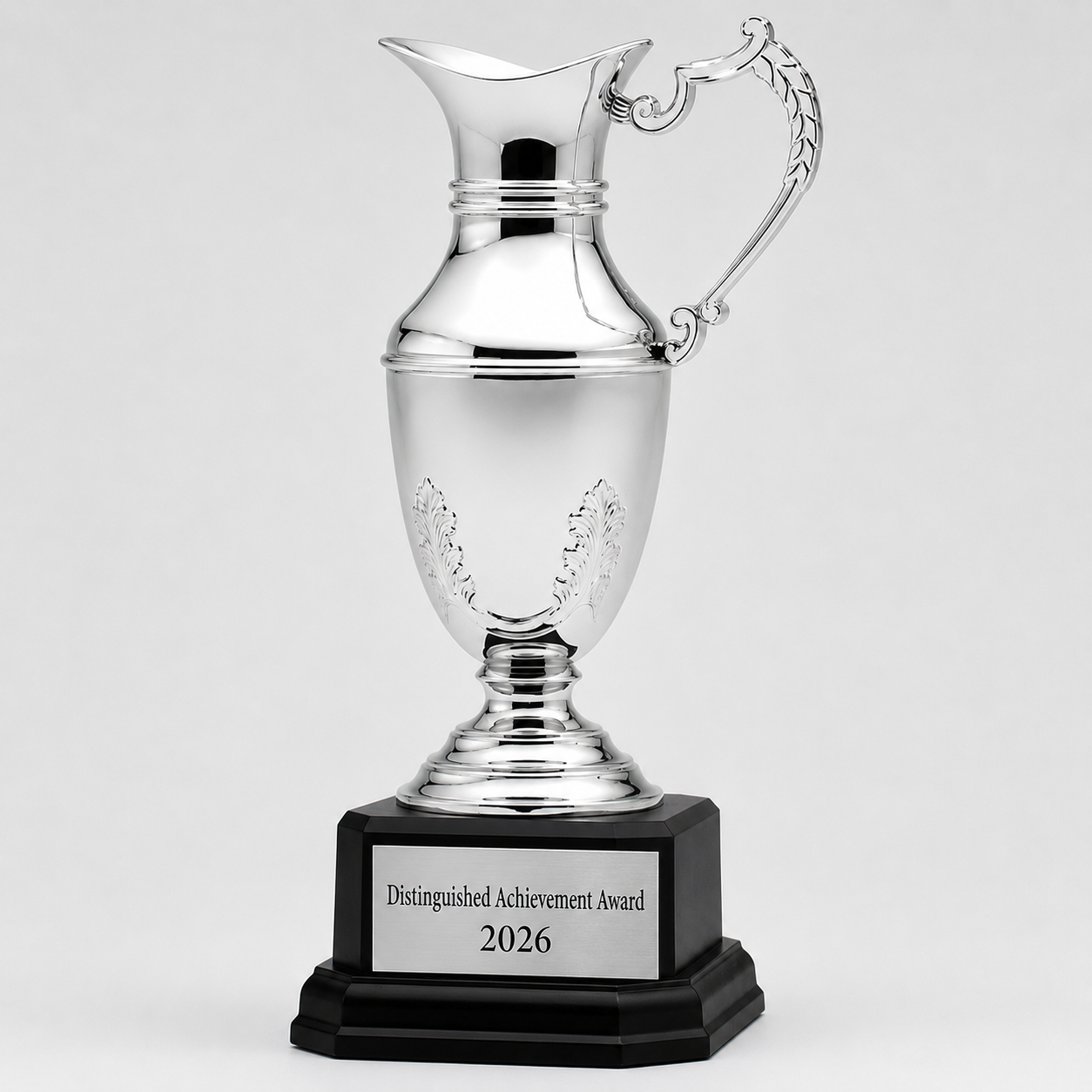 Silver cup trophy with a black base and engravable plate for awards and events.