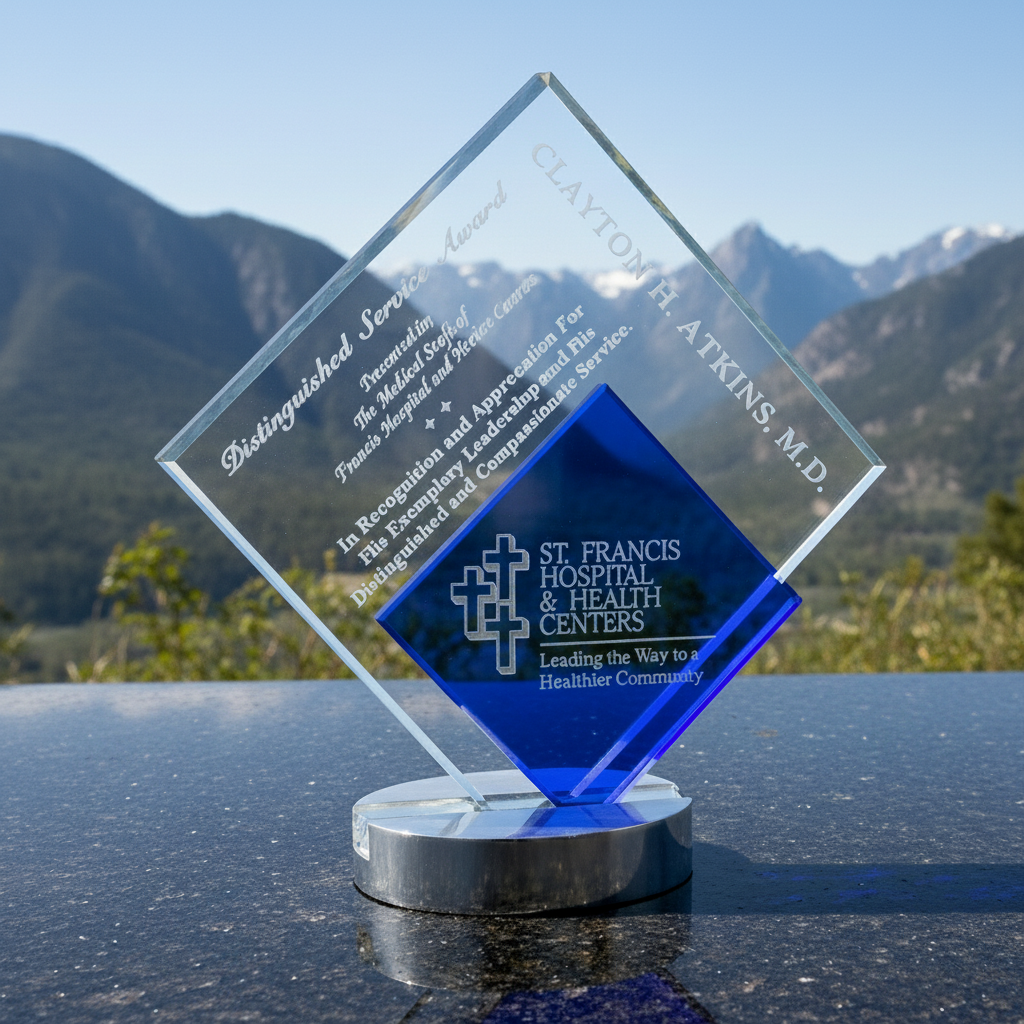 Crystal Glass award with blue accent on a reflective surface with mountains in the background
