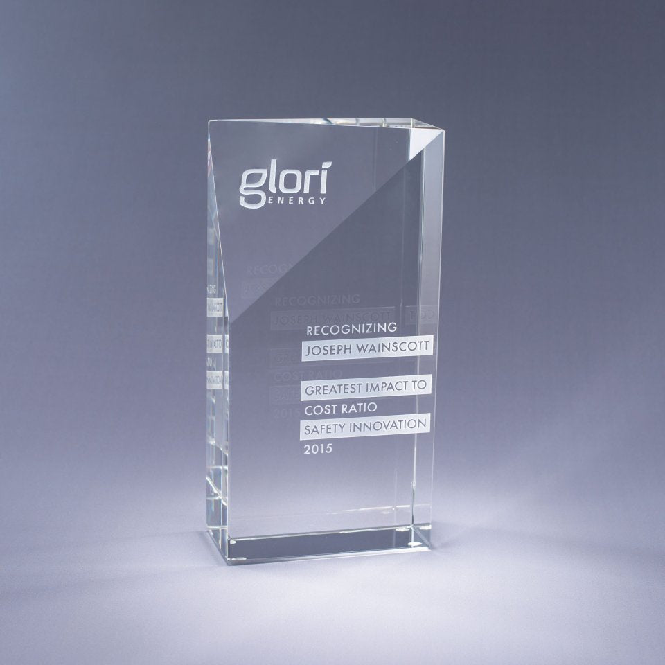 Clear Crystal glass award with sand etch engraved text and logo on a gray background