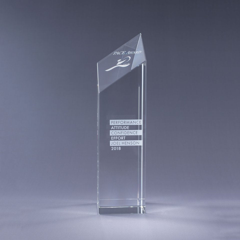 Clear Crystal glass award with sand etch engraved text and logo on a gray background