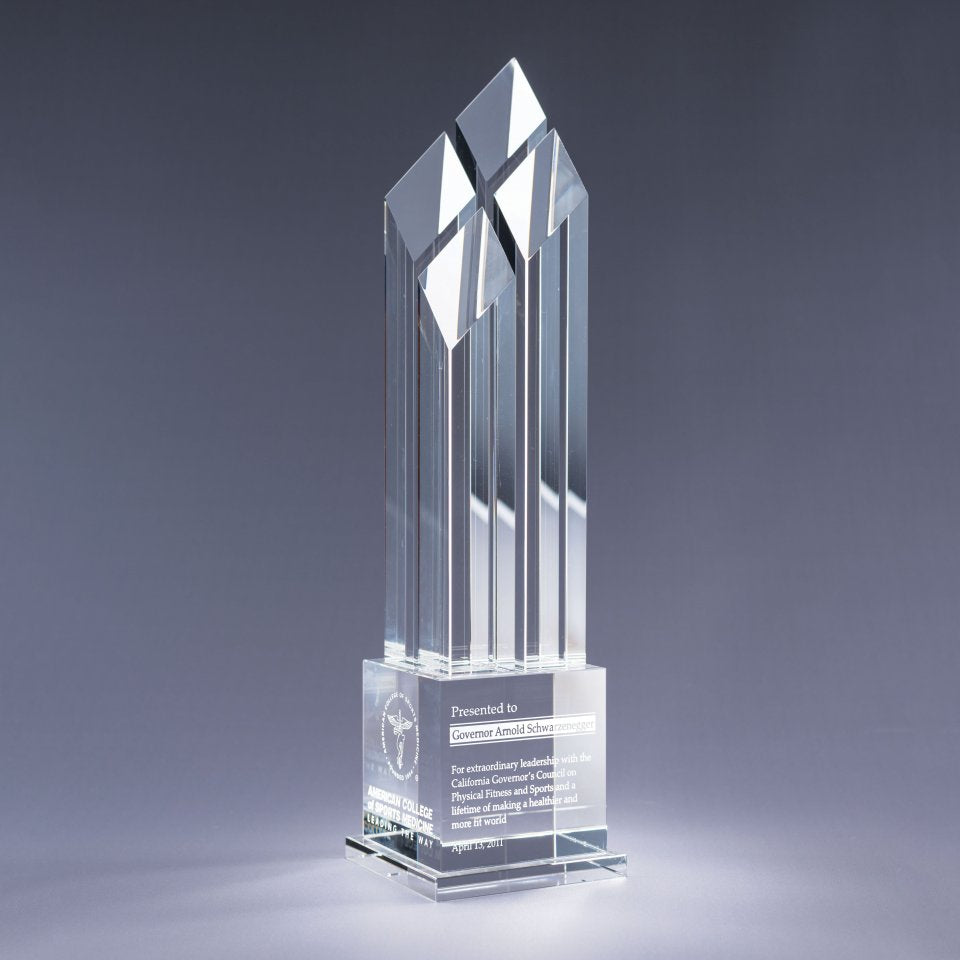 Clear Crystal glass award with sand etch engraved text and logo on a gray background