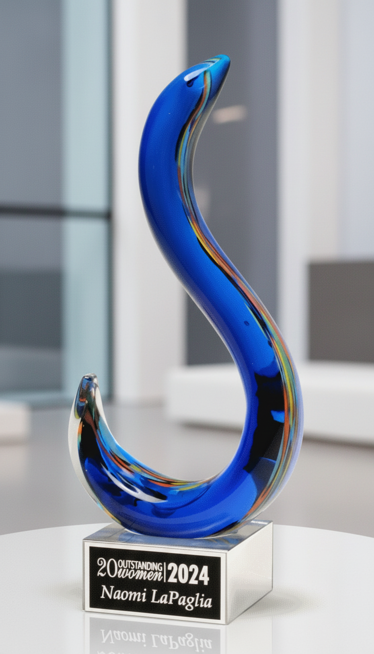 Blue glass abstract sculpture award on a white surface 