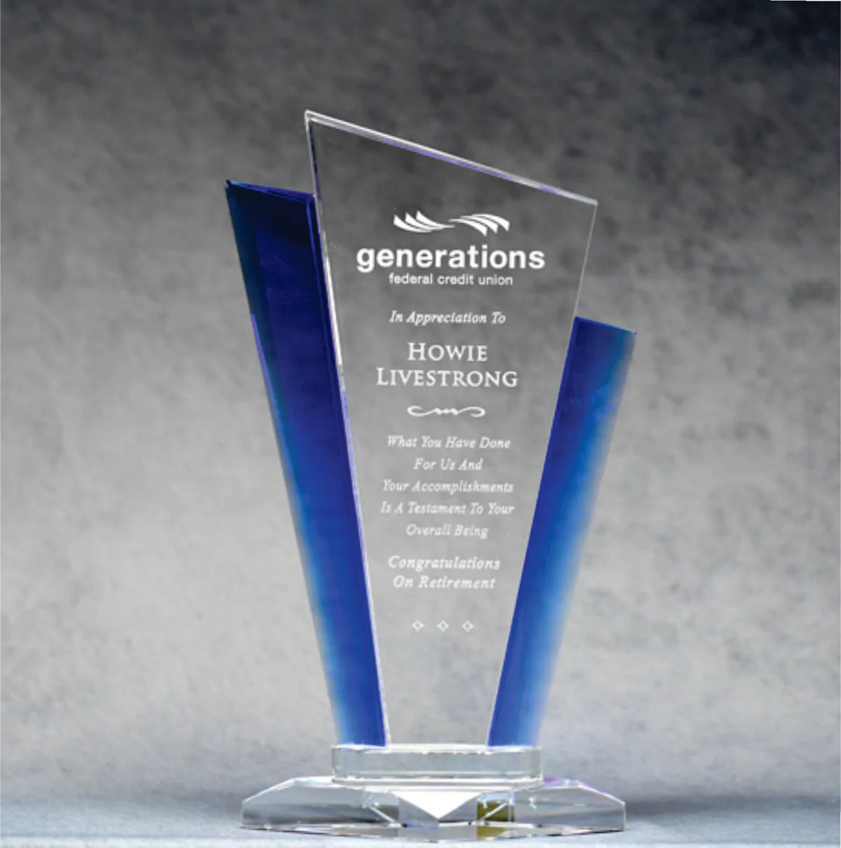 Elegant Slant top optic crystal award with blue accents, sand etch engraving of text and logo