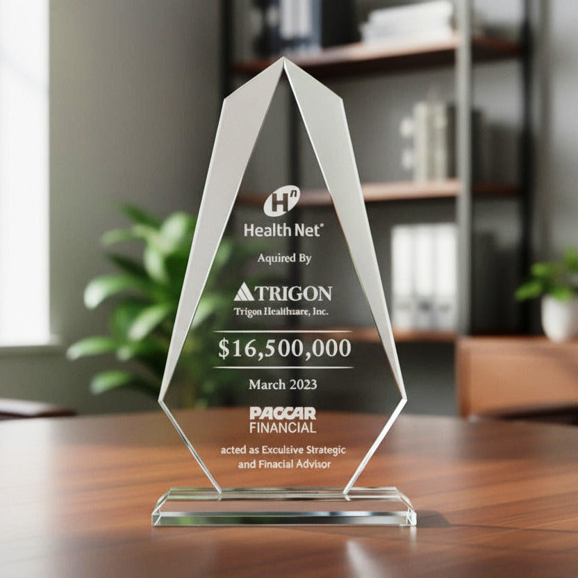 Elegant Crystal Glass award on a wooden table with blurred office background