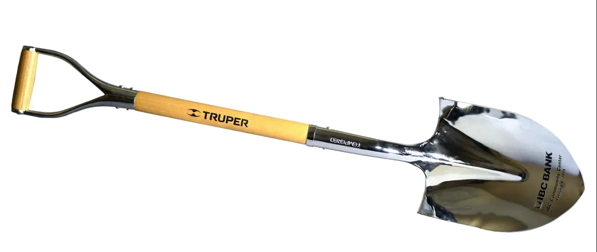 Shovel with a yellow handle and metallic blade on a white background