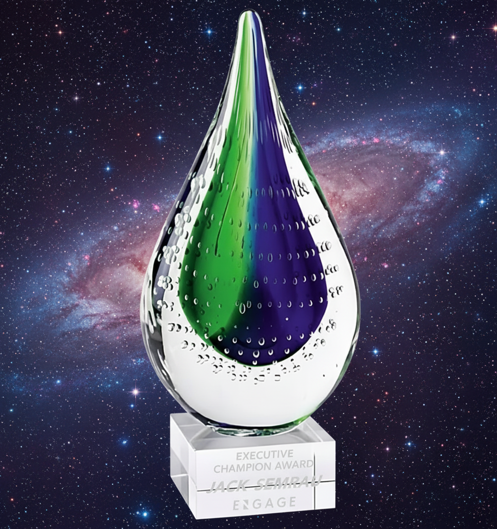 Specialty Engraving Crystal award with green and purple interior against a cosmic background