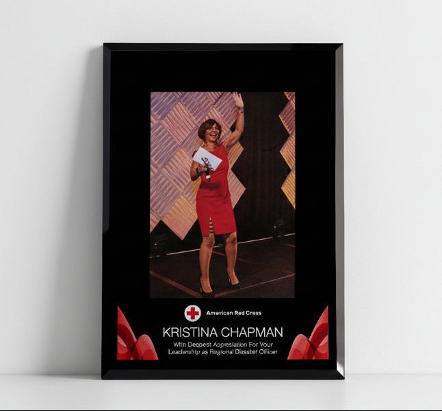 Framed picture of a woman in a red dress with American Red Cross branding on a white background