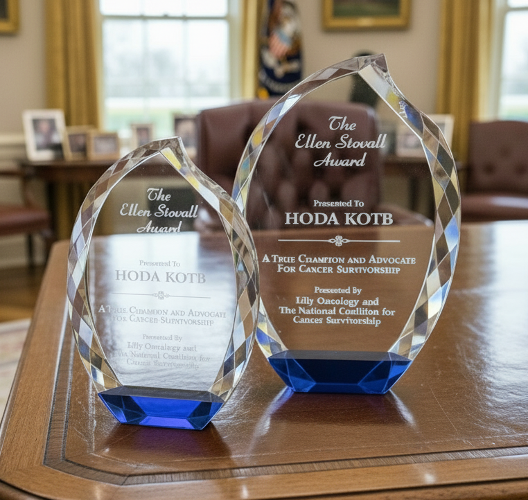 Two crystal awards on a the resolute desk in the white house