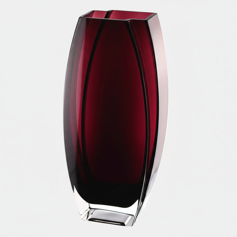 Red glass vase on a white background